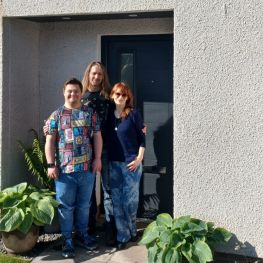 Merek, Aneta and Jakub outside their new home